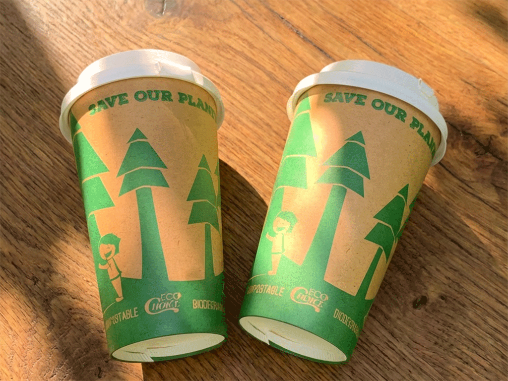 two eco coffee cups on wooden table, made by YamiPak Coffee
