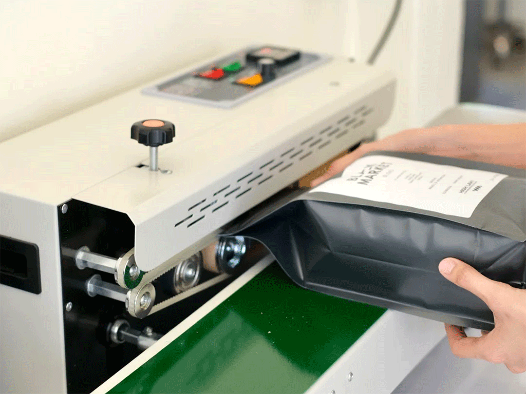 coffee-bag-sealing-machine-silver-metal-heat-sealing-process-side-view