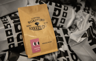 Coffee bag with brown kraft paper packaging, showcasing espresso blend, with a minimalist design.