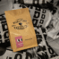 Coffee bag with brown kraft paper packaging, showcasing espresso blend, with a minimalist design.