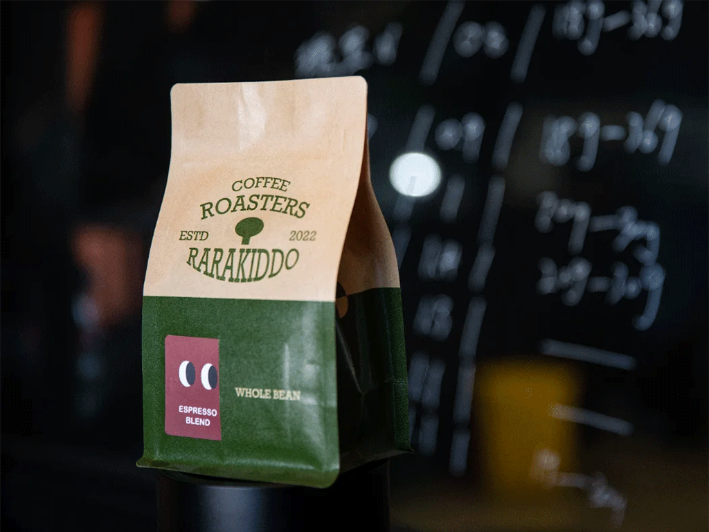 Coffee bag with brown kraft paper packaging, showcasing espresso blend in front of a dark background.