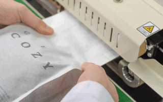 Recyclable rice paper coffee bag undergoing heat sealing process