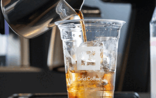 Iced cold brew coffee in a clear, custom disposable cup with ice — cold brew coffee trends.