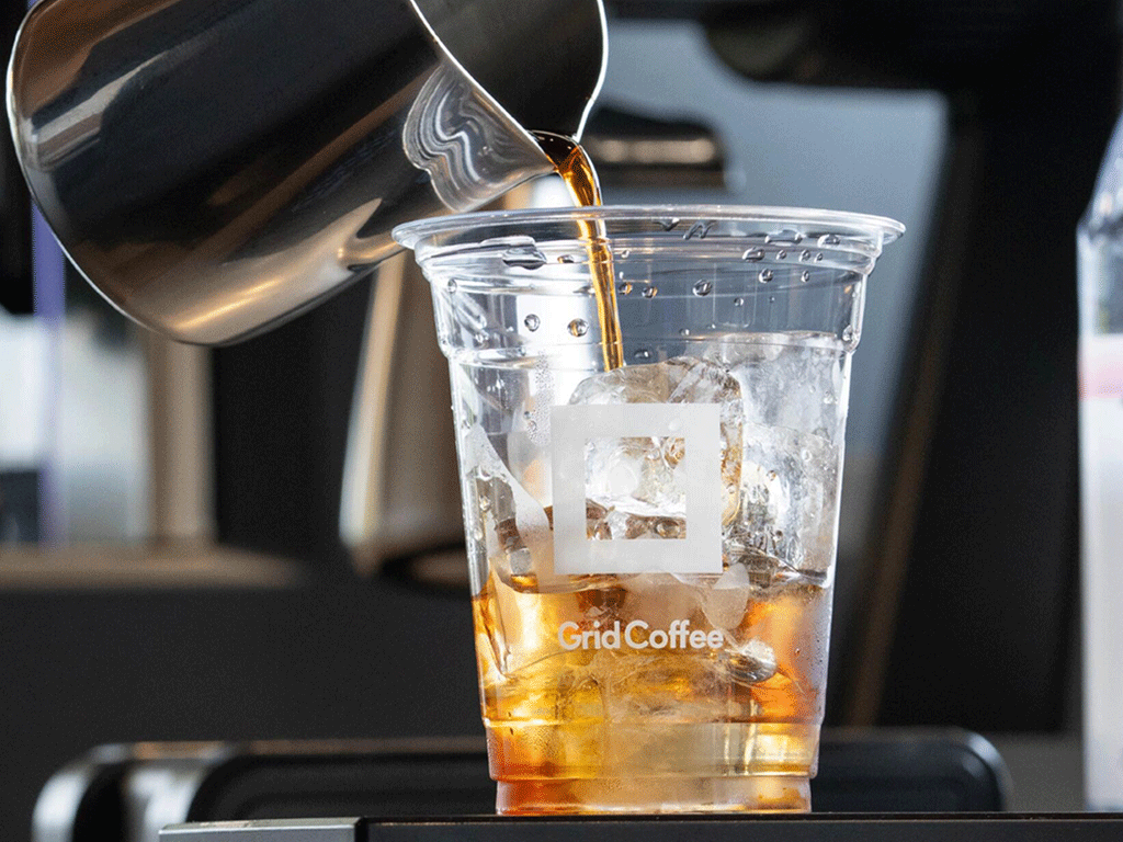 Cold_Brew_Coffee_Trends_You_Need_to_Know_1 Iced cold brew coffee in a clear, custom disposable cup with ice — cold brew coffee trends.