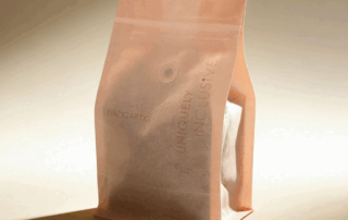 Custom rice paper coffee bag on a neutral background, highlighting sustainable packaging for roasters