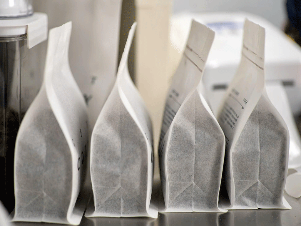 Side view of multiple rice paper coffee bags lined up, highlighting sustainable packaging for roasters