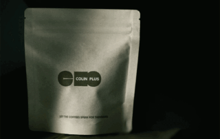 stand-up coffee packaging bag displayed in low light studio setting