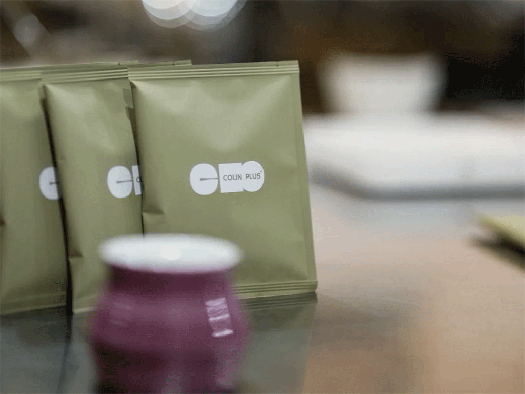 single serve coffee packaging displayed on table in café setting