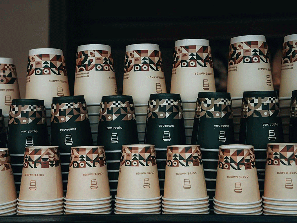 stacked coffee cups in a cafe representing everyday coffee service