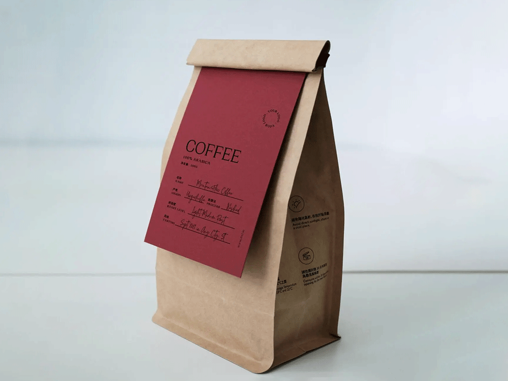 Kraft paper coffee bag with a red coffee tasting card attached to the front