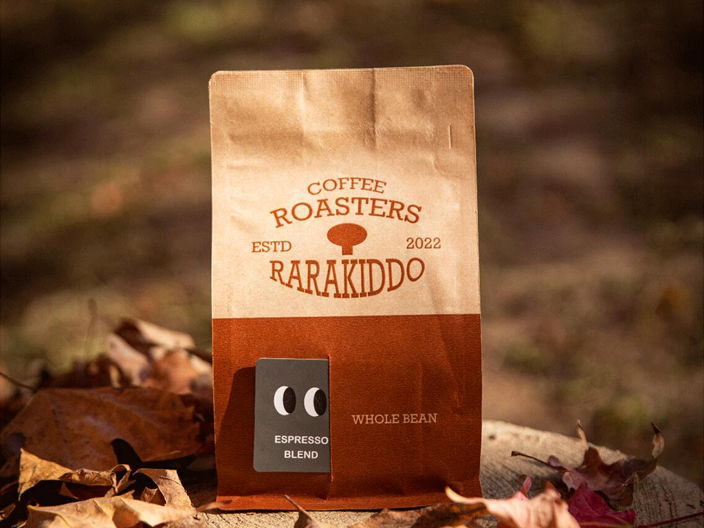 Does_Coffee_Packaging_Affect_Coffee_Freshness_1 Kraft paper coffee bag with espresso blend label displayed outdoors among autumn leaves