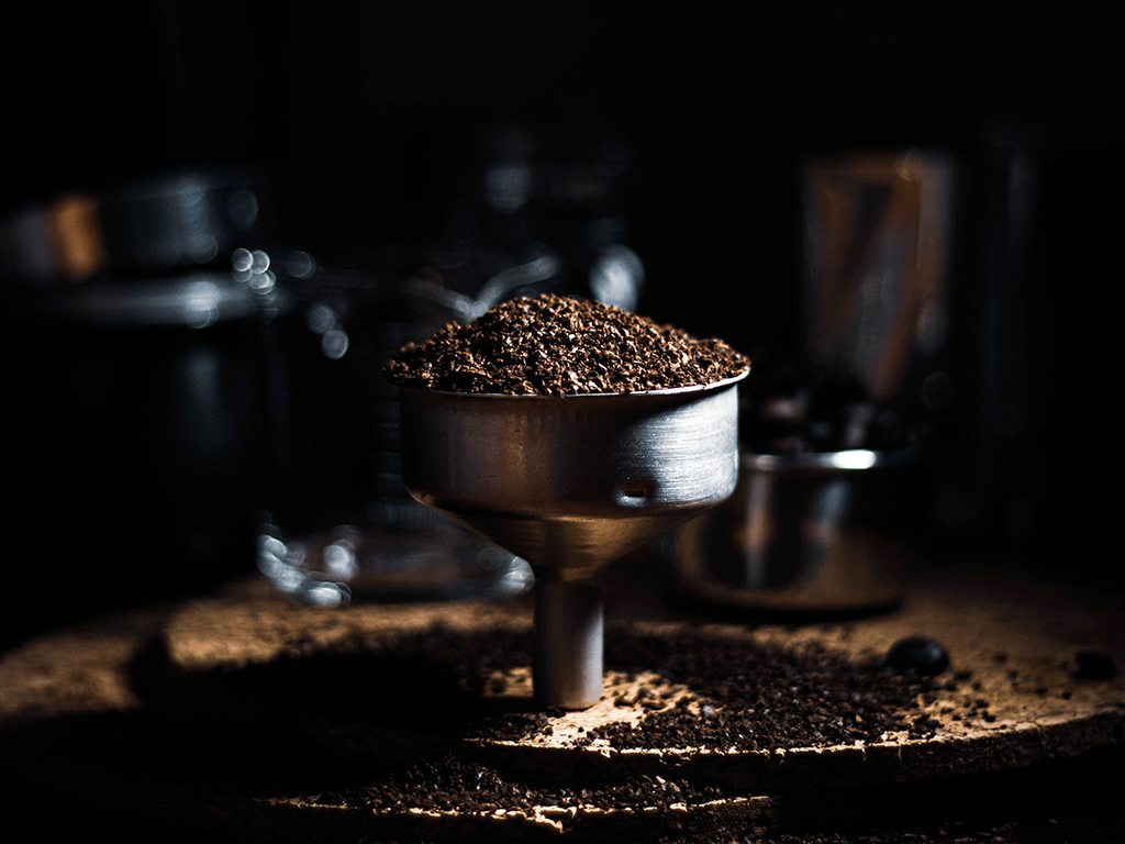Used coffee grounds after brewing showing coffee waste generated by coffee businesses