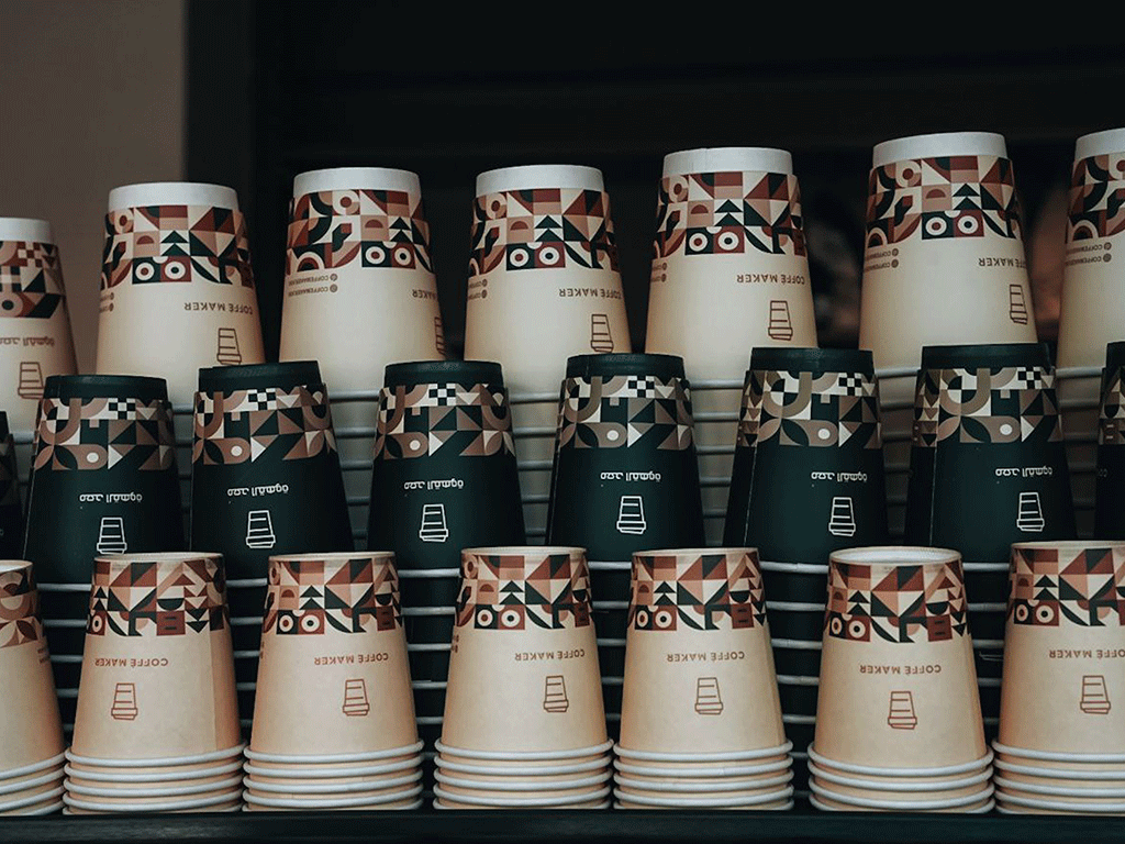 Custom printed takeaway coffee cups stacked for café and coffee shop service