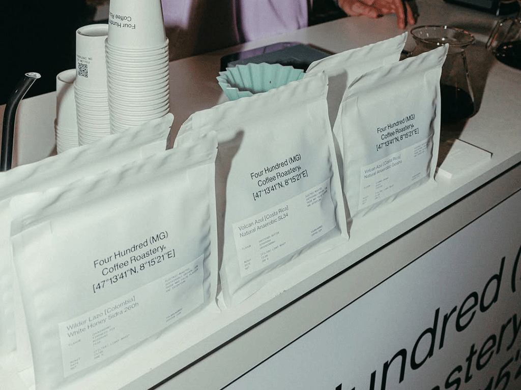 Multiple coffee bags with tear notch designs displayed for coffee roasters