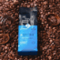 Premium printed custom coffee bag manufacturer product surrounded by fresh beans