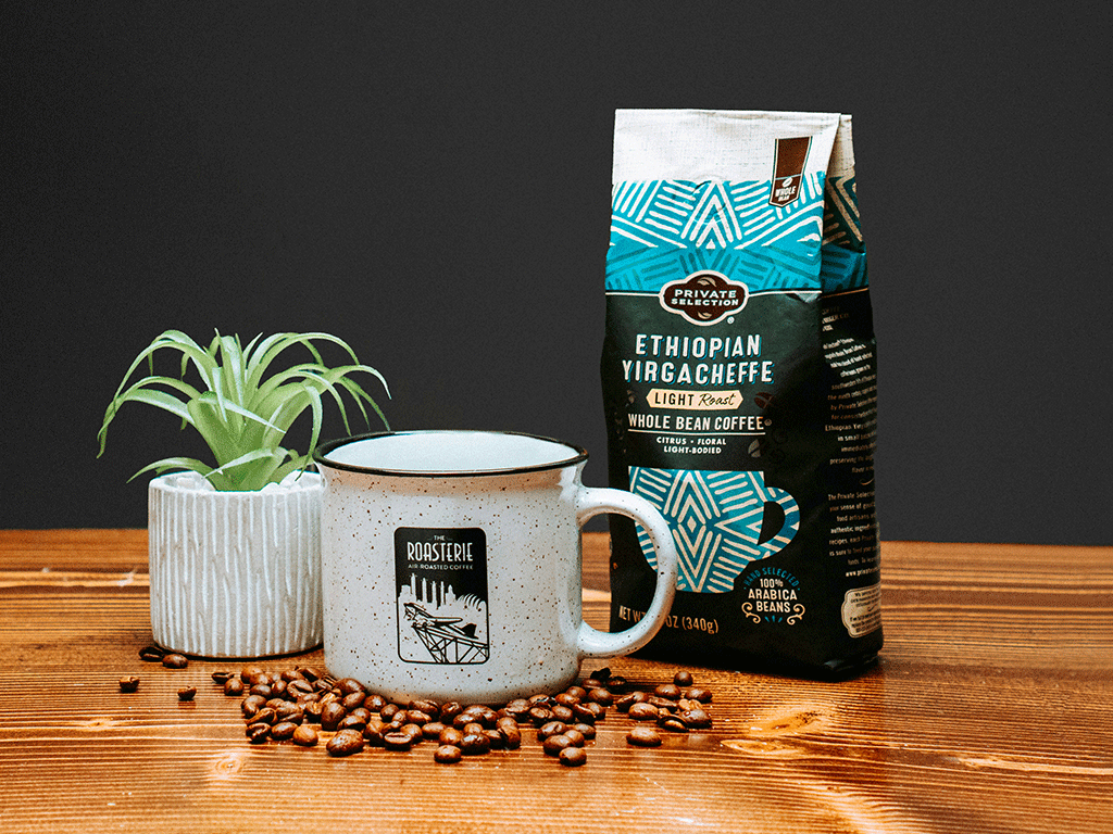 Custom branded coffee bag manufacturer product displayed with mug and beans