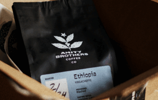Black coffee bag with origin label for a coffee packaging redesign