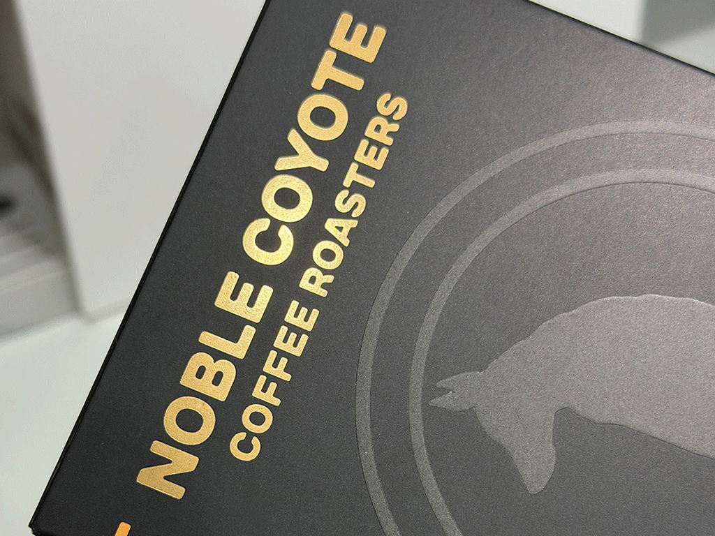 Black coffee box packaging with gold hot foil stamping on the surface lettering