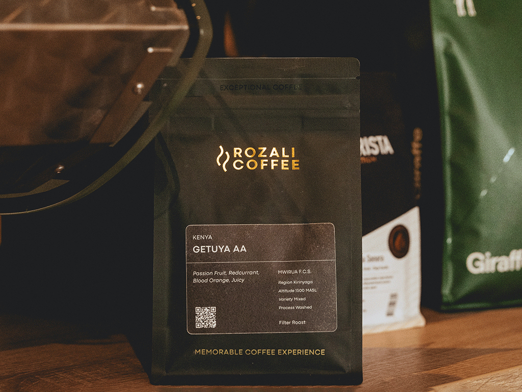 Premium black coffee bag with custom branding and label design for roasted coffee beans