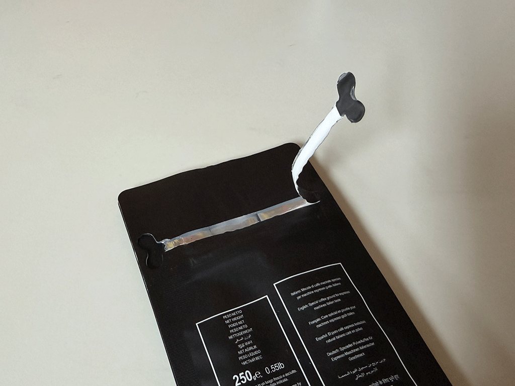 open coffee bag showing resealable zipper closure for repeated opening