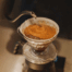 Water poured over coffee grounds during the blooming stage