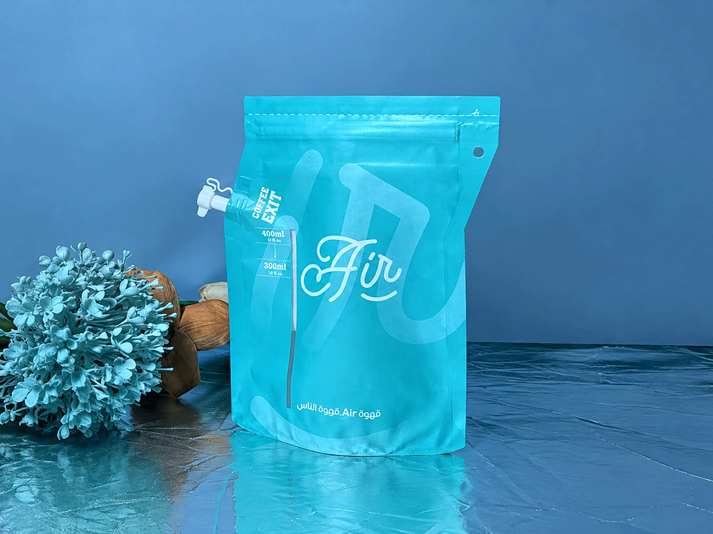 Coffee_Brewing_Bags_What_Roasters_Should_Know_1 Turquoise coffee brewing bag with a white spout