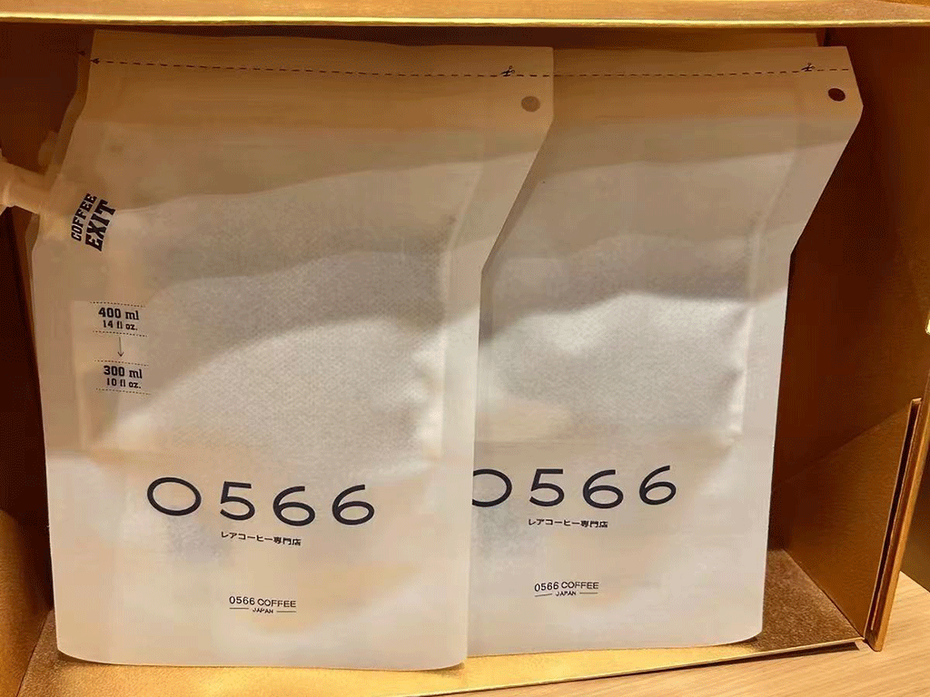 Two custom white coffee brewing bags with measurement markings